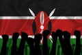 Silhouette of raised arms and clenched fists on the background of the flag of kenya. The concept of power, conflict. With place