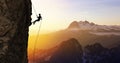 Silhouette Rappelling from Cliff