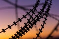 Silhouette Razor Barbed Tape Wire And light in the evening Royalty Free Stock Photo