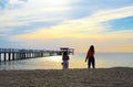 Silhouette rear view of young woman standing on the beach near the sea and sky Twilight background for amazing landscape