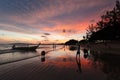 Silhouette and reflection of boat and people against the sunset sky Royalty Free Stock Photo