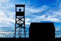 Silhouette of refugee camps and observation towers