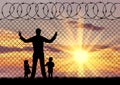 Silhouette refugees father and two children