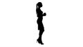 Silhouette Relaxed stylish businesswoman drinking coffee walking.