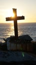 Silhouette of a religious Cross Crucifix against a sunset