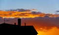 Silhouette of residential building at sunset