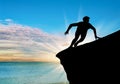 Silhouette resistant person on a rock Royalty Free Stock Photo