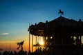 Silhouette of a retro carousel at sunset Royalty Free Stock Photo