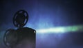 Silhouette of retro film projector on dark background. 3D rendered illustration Royalty Free Stock Photo