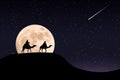 Silhouette of riders on their camels in the desert at night