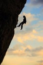 Silhouette of rock climber against cloudy sky Royalty Free Stock Photo