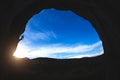 Silhouette of a rock climber climbing an arch shaped rock Royalty Free Stock Photo