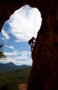Silhouette of rock climber climbing the cliff Royalty Free Stock Photo