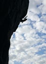 Silhouette of rock climber climbing cliff Royalty Free Stock Photo