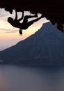 Silhouette of a rock climber at sunset