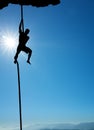 Silhouette of rock climber vertical image