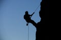 Silhouette rock climbing