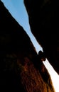 Silhouette of rock stuck between two rocks