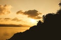 Silhouette of romance couple sitting on a rock Royalty Free Stock Photo