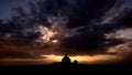 Silhouette of Romanian church with ray light after storm Royalty Free Stock Photo