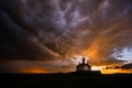 Silhouette of Romanian church with ray light after storm Royalty Free Stock Photo
