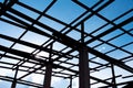 Silhouette Roof structure with steel on the concrete pillars and blue sky