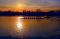 Silhouette of row boat against sunset on the lake Royalty Free Stock Photo