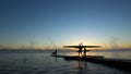 Silhouette of rower at sunrise