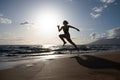 Silhouette of runner woman exercising in running sprint workout at beach jogging, healthy outdoors activity. Royalty Free Stock Photo