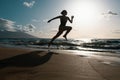 Silhouette of runner woman exercising in running sprint workout at beach jogging, healthy outdoors activity. Royalty Free Stock Photo