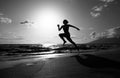 Silhouette of runner woman exercising in running sprint workout at beach jogging, healthy outdoors activity. Royalty Free Stock Photo