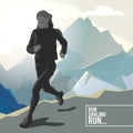 Silhouette of a running girl athlete on the background of mountains