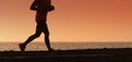 Silhouette of running man on sunset fiery sky Royalty Free Stock Photo