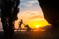 Silhouette of running mother with stroller enjoying motherhood a