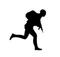 Silhouette of a running soldier