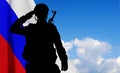 Silhouette of russian soldier on background of sky