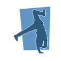 Silhouette of a male dancer doing hand stand pose. Royalty Free Stock Photo