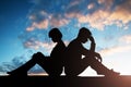 Silhouette Of Sad Couple Sitting Back To Back Royalty Free Stock Photo