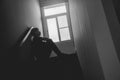 Silhouette Sad young man sitting at the stairs in the dark, Depression and anxiety disorder concept, Life problems, illness, Royalty Free Stock Photo