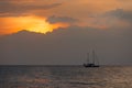 Silhouette sail boat in sunset