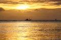 Silhouette of sailing boat on horizon of tropical sunset sea Philippines Royalty Free Stock Photo