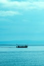 Silhouette of sailing boat at Kvarner bay of Adriatic sea in summer morning Royalty Free Stock Photo