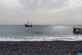 Santa Cruz - Silhouette of sailing boat ship on the majestic Atlantic Ocean seen from Praia Santa Cruz, Madeira island Royalty Free Stock Photo