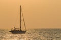 Silhouette of sailing yacht boat floating over sun set sky sea , Royalty Free Stock Photo