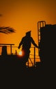 Silhouette of a sailor at golden sunset