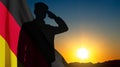 Silhouette of saluting soldier with Germany flag