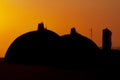 Silhouette of San Onofre nuclear power plant main reactors at sunset