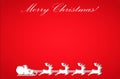 Silhouette of Santa Claus flying with the sleigh and his reindeer on Christmas background Royalty Free Stock Photo