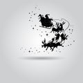 Silhouette of Santa Claus in a sleigh with deer flying in the sk Royalty Free Stock Photo