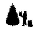 Silhouette Santa puts gifts under tree